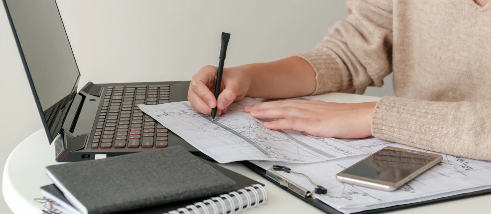 Trader reviewing losing trades to learn and improve performance