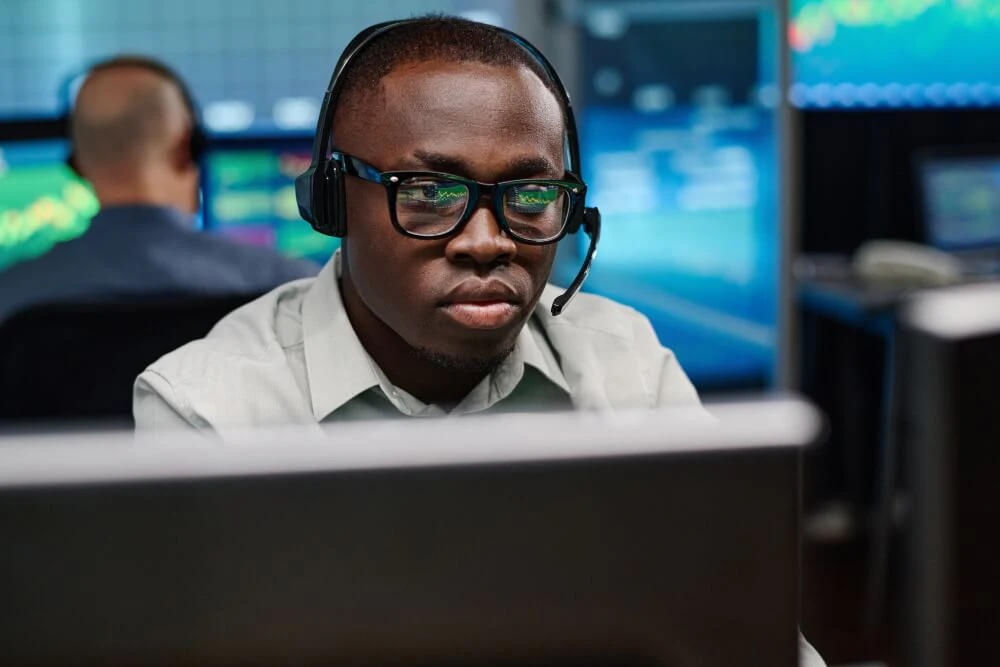 Professional bank traders analyzing multiple forex markets and managing institutional order flow