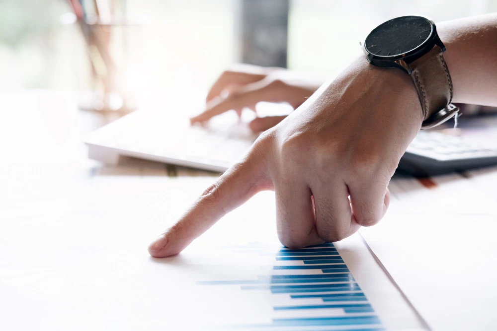 Trader reviewing charts after completing trades to improve performance