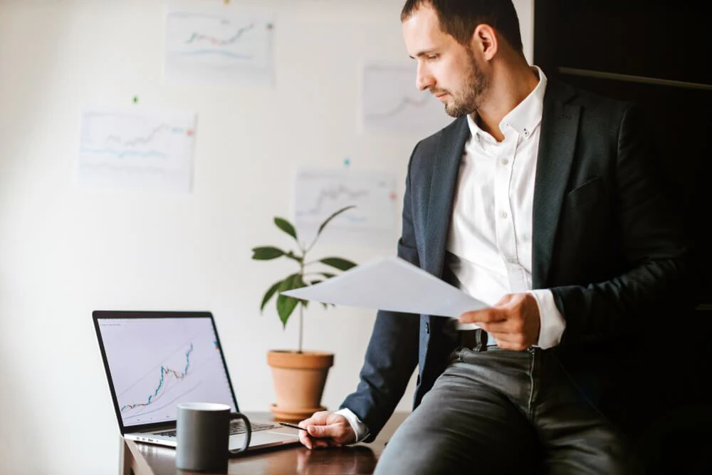 Forex trader analyzing charts and planning trades in a structured environment