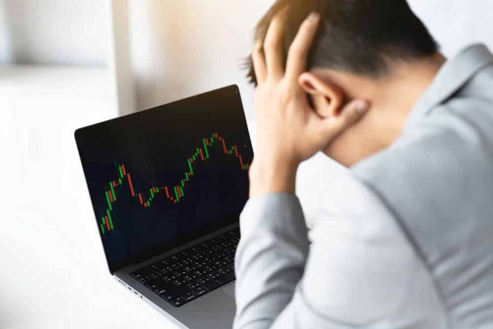 Trader feeling mentally exhausted and overwhelmed while trading