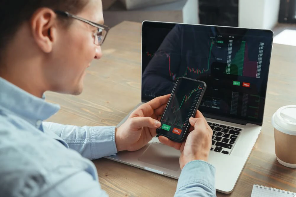 Trader analyzing charts and sensing market movement intuitively