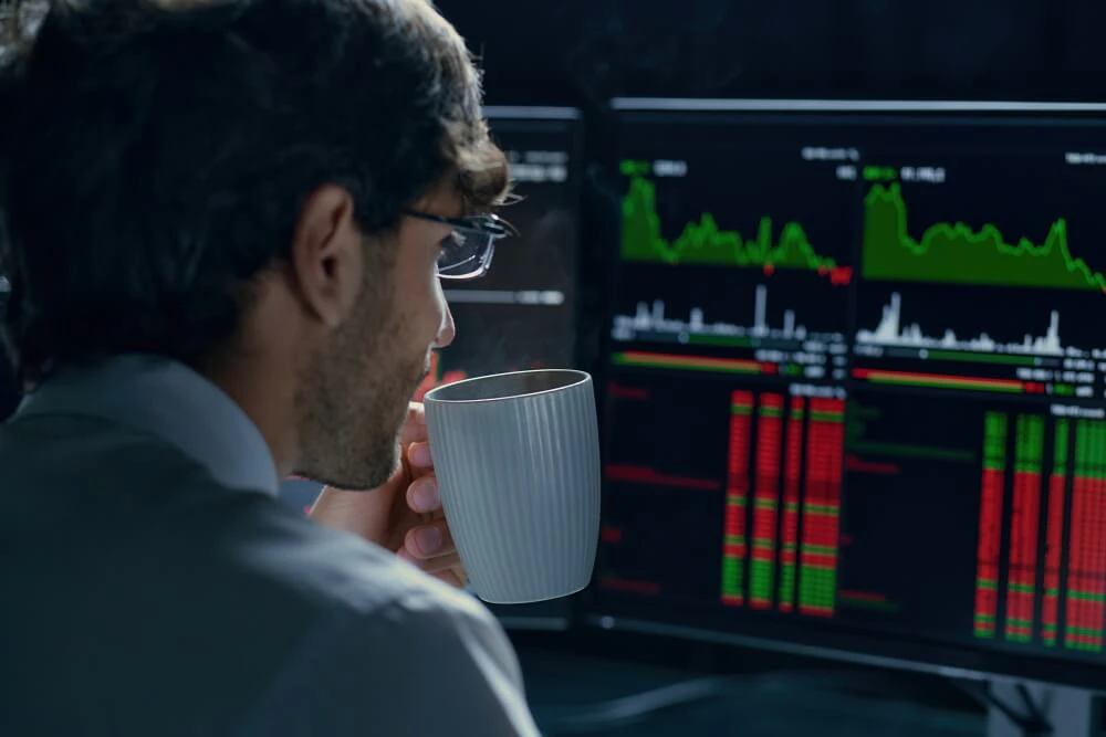 Trader patiently waiting and analyzing charts before entering a trade