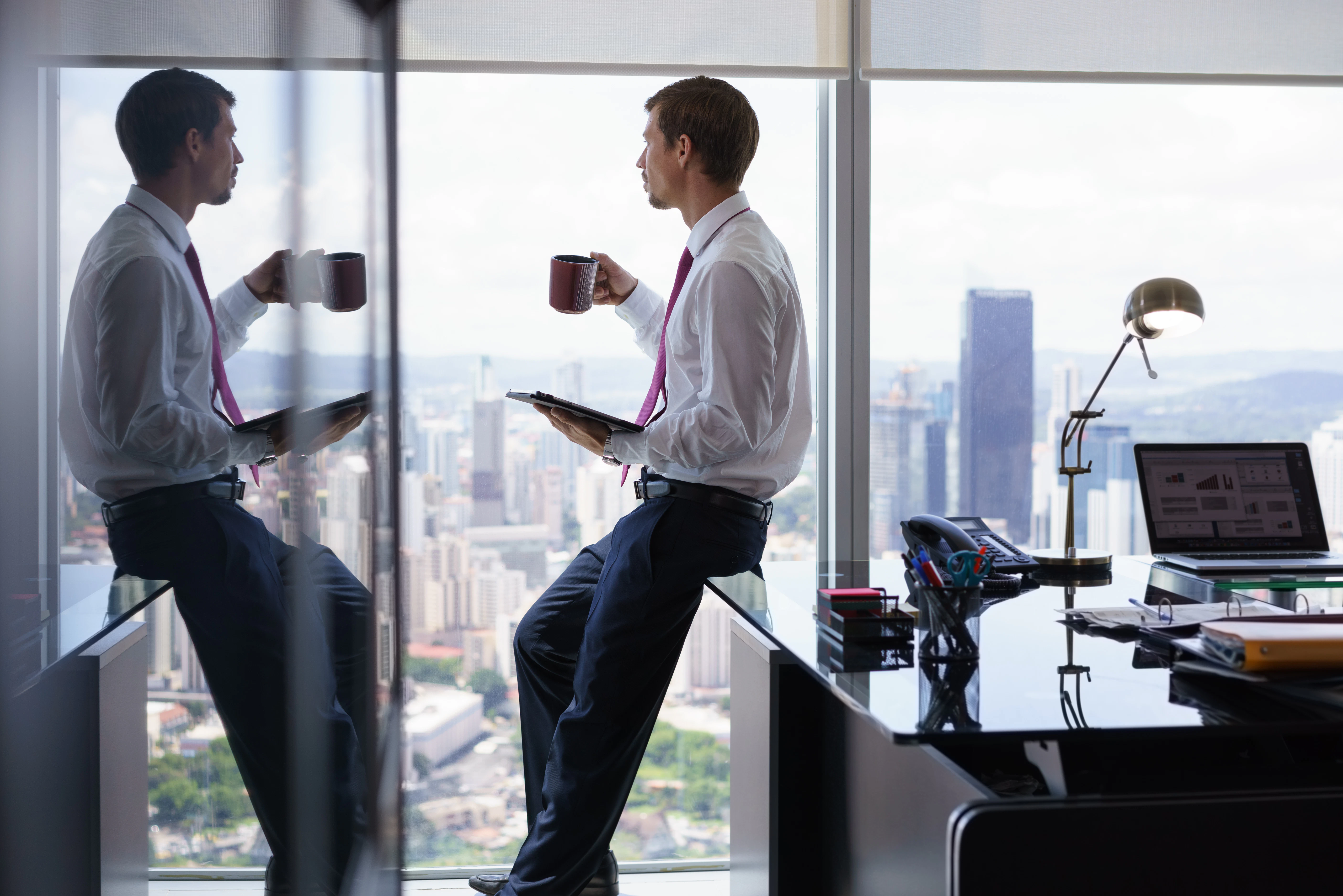 trader sitting on desk